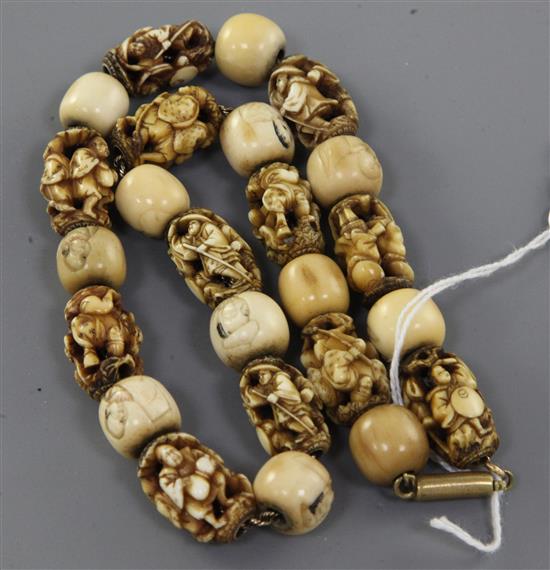 A Japanese ivory and bone Ojime bead necklace, late 19th century,